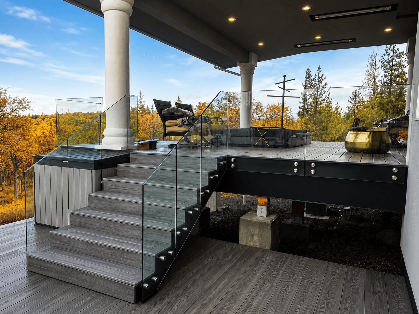 Frameless glass deck railing over an autumn forest view, Goldendale