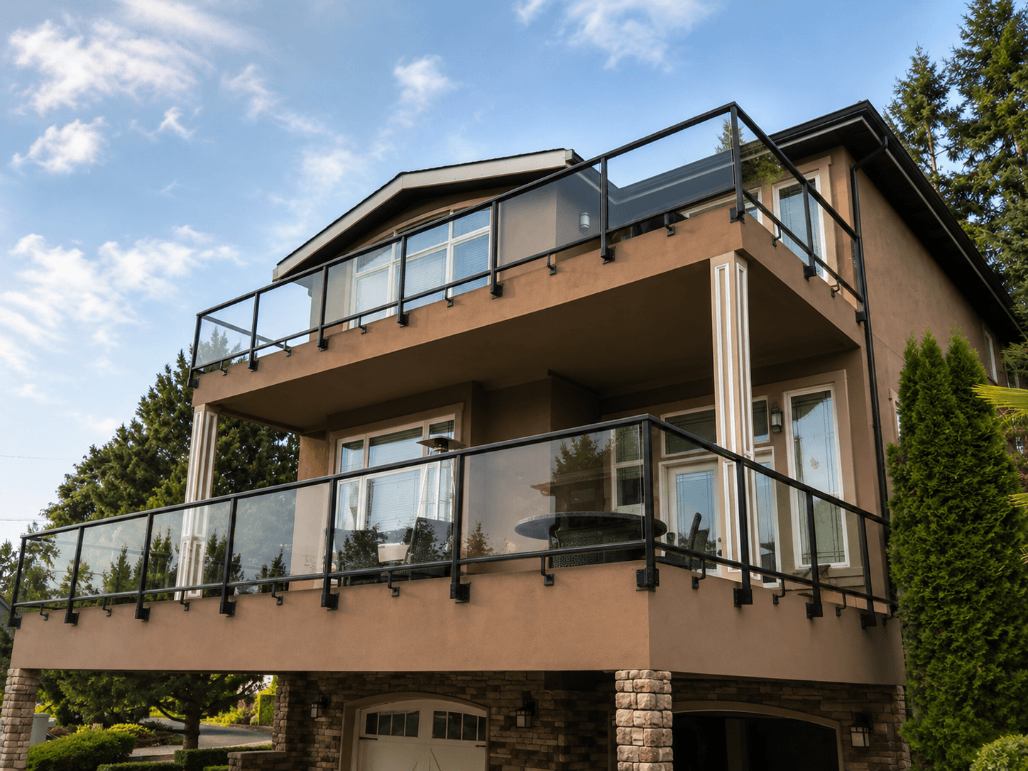 Framed glass balcony railings with black posts on a multi-level Kirkland home