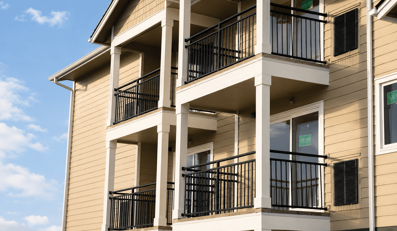 Black aluminum vertical picket railings with double mid rail on multi-level balconies, a recent install in Mattawa, WA