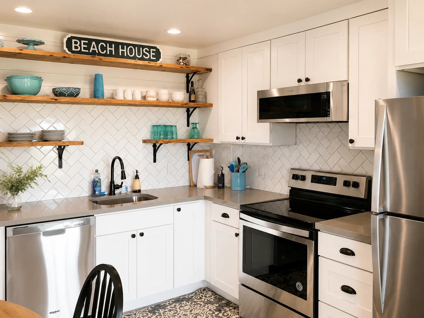 Remodeled kitchen with new cabinets, tile backsplash, and appliances
