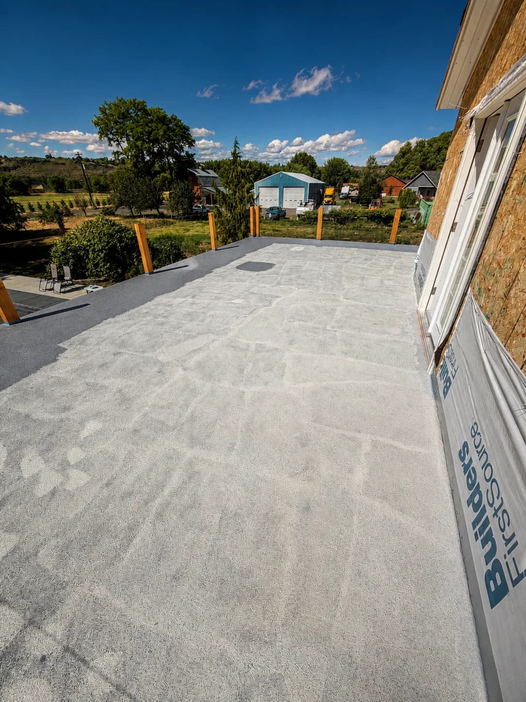 Waterproof membrane deck on a new build, posts in place for railing